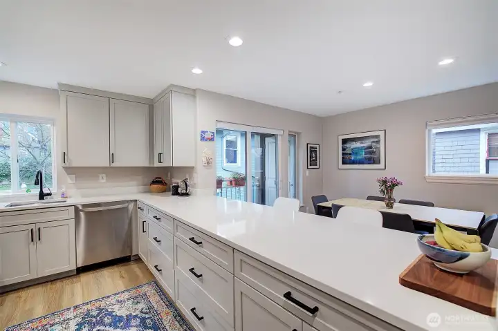 Beautiful updated kitchen with stainless steel appliances, quartz countertops and tons of storage.