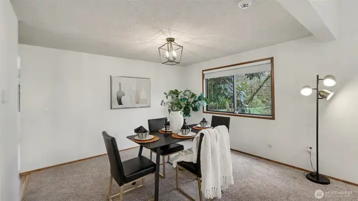 Bright and welcoming, this dining area offers the perfect setting to gather, dine, and unwind.