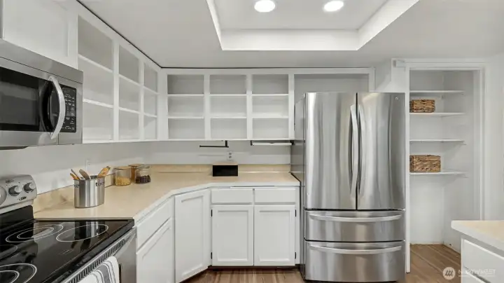 A spacious layout with abundant storage options, including open shelving for easy access and display.