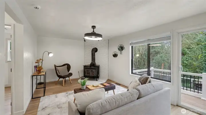 A cozy second living space featuring a charming wood stove—perfect for relaxing evenings and quiet moments.