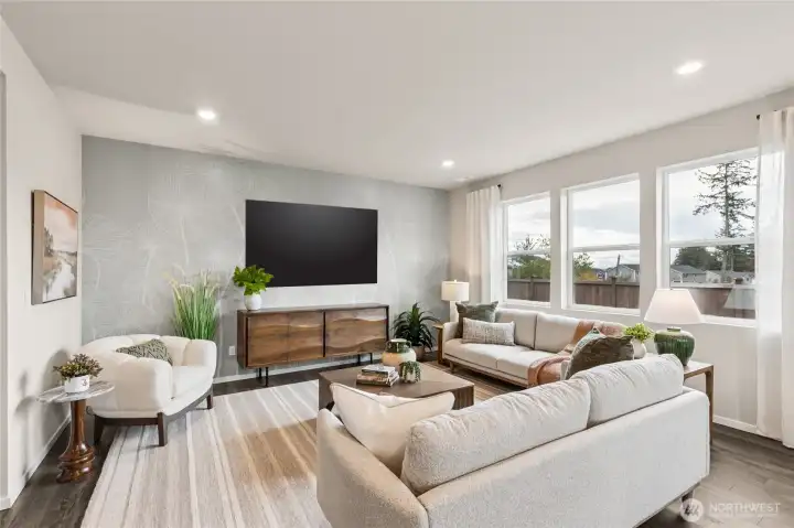 Big great room that can accommodate three couches and lots of room for relaxing together. **Photo is representational. Photos virtually staged Actual home is under construction. Colors, materials, and features may vary. See site agent for details.**