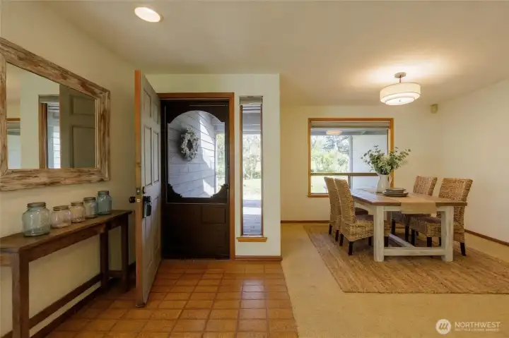 Tiled entry with formal dining space...