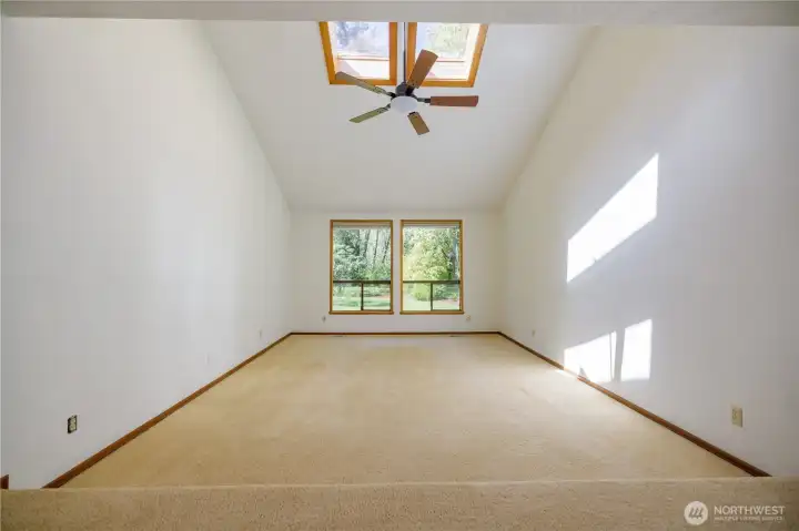 ...vaulted ceilings, skylights and views to the backyard.