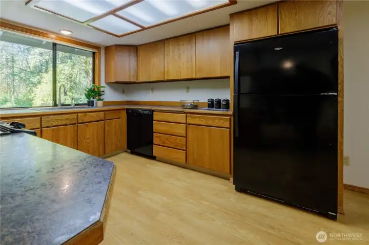 Kitchen is well appointed, lots of storage and counter room - plus a dining nook.