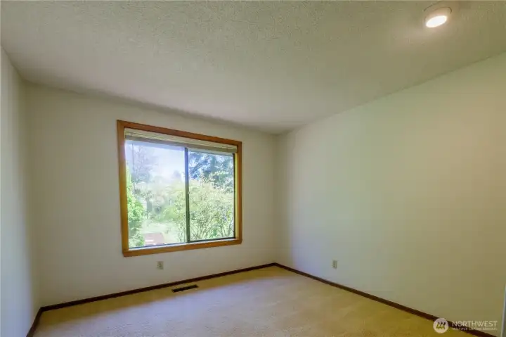 Third bedroom in the wing with views to the front yard...