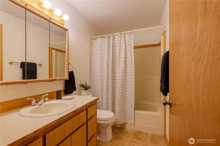 Second and second largest bedroom has views of spring flowers of the front yard.