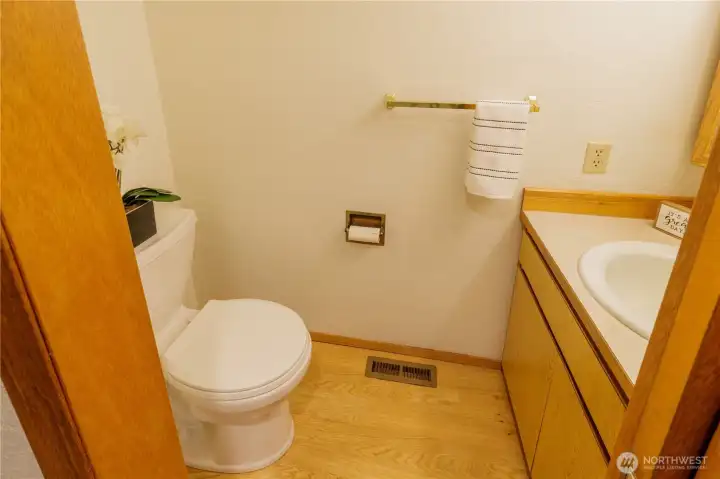 Half bathroom, conveniently near living spaces.