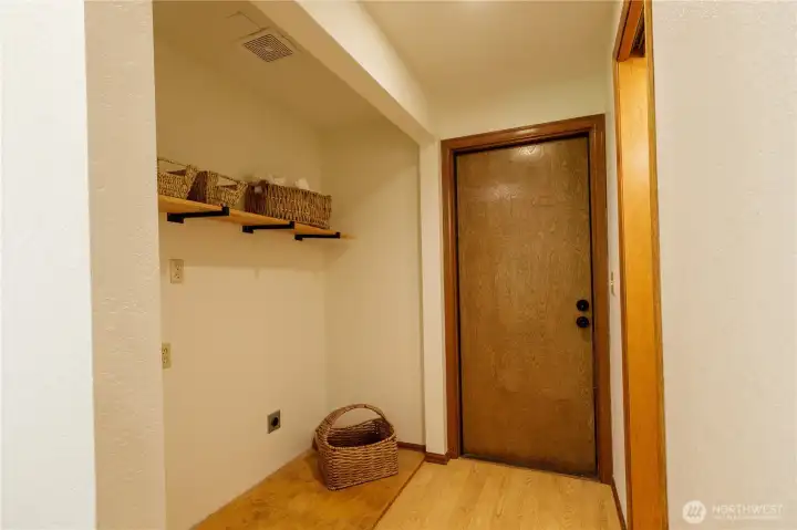 Utility nook near entry to the garage.