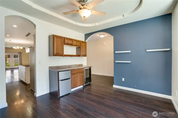 Dining room with mini bar, fridge and wine fridge.