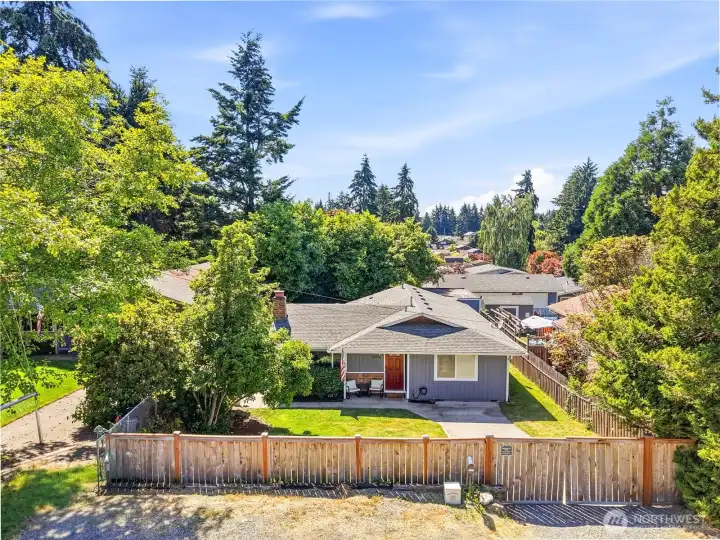 Newer entry gate and front fence. There is a hidden person gate in addition to the swinging vehicle gate for easy entry. TONS of additional parking in front of home off the street.