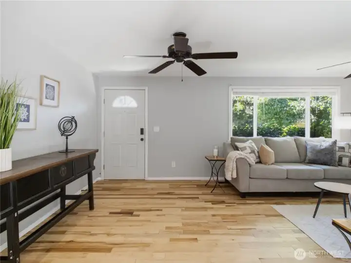 New hardwood floors throughout main living area, kitchen, dining room and hallway.
