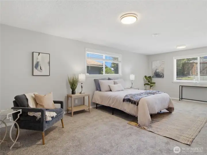Oversized room, currently staged/utilized as a primary suite. But it could be a bonus room, additional living area, guest room, home office, etc.