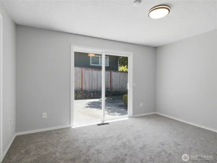 Bedroom that connects to bathroom, with slighter to patio/courtyard.