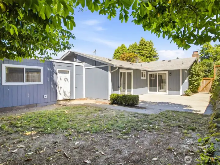 Don't miss the covered storage shed area between garage and house.