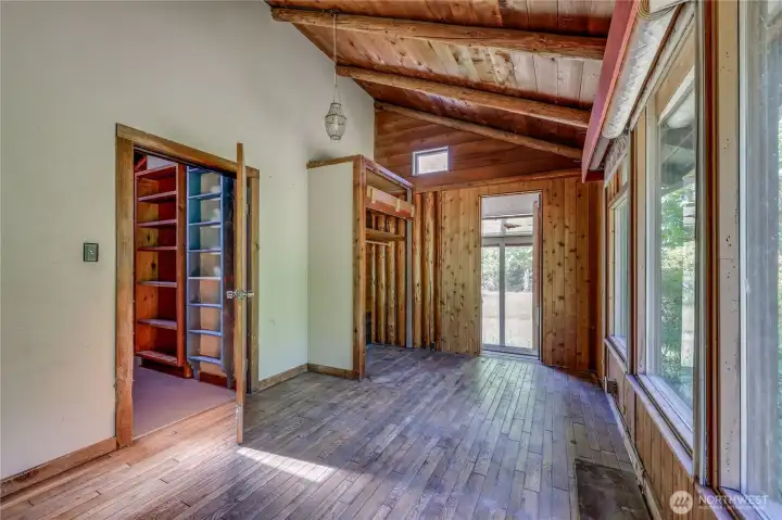 Bedroom on back side of house, looking towards enclosed porch