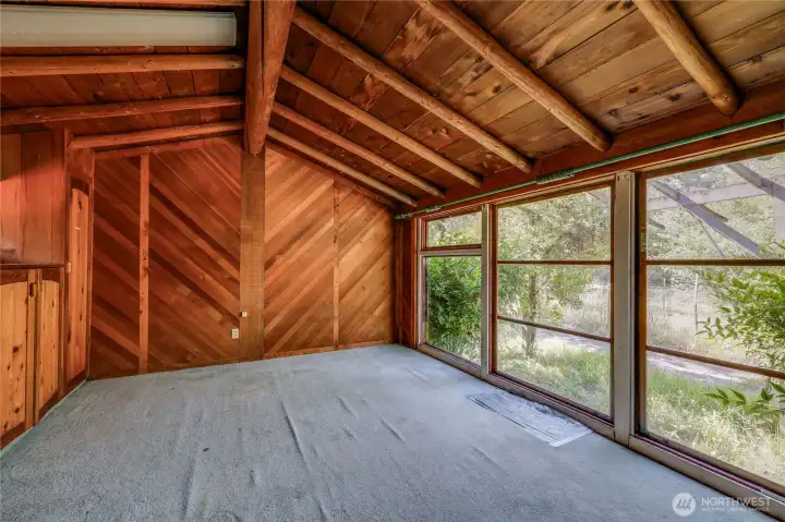 Bedroom on front corner of house with half bath