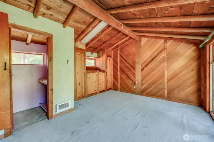 Bedroom on front corner of house with half bath
