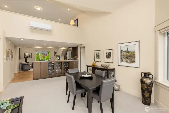 The dining room flows into the kitchen and features a custom built-in bar and buffet for effortless entertaining