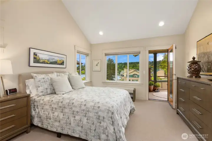 The main floor primary bedroom suite opens to the view deck
