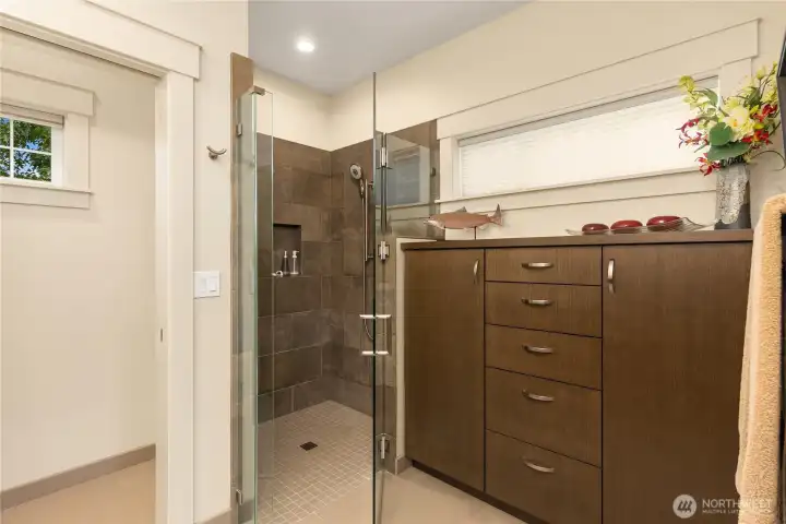 ...zero-entry shower, and beautiful built-in cabinetry