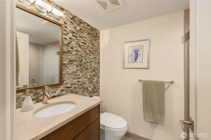 Adjacent bathroom with zero-entry shower