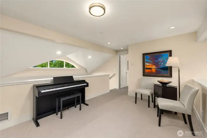 Upstairs, a loft overlooks the living and dining rooms