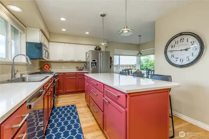Chef-ready kitchen completely modernized with sleek quartz countertops, stainless steel appliances, and a new dishwasher (2025).