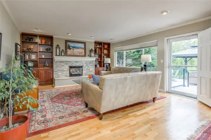 Living room provides direct access to the back deck with metal gazebo.