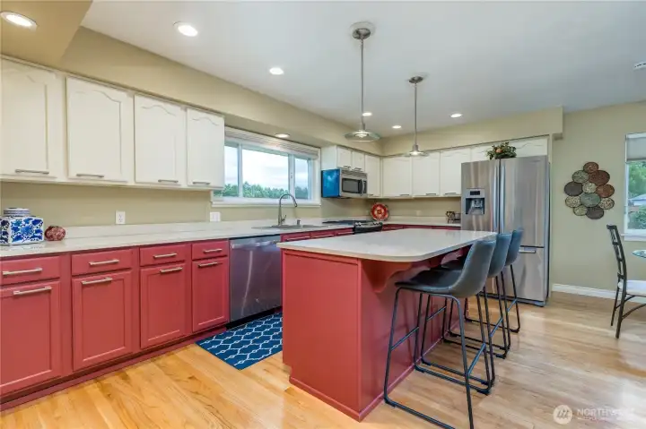 Large center island offers counter seating.