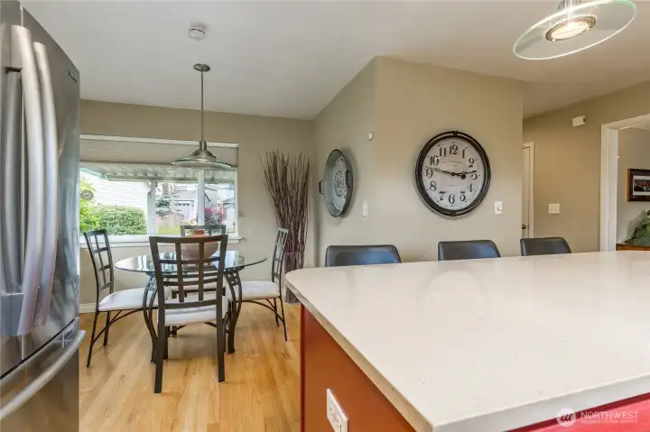 Kitchen and breakfast nook with a convenient walk-in pantry around the corner.