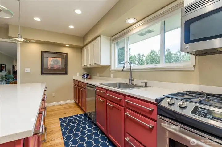 Gas range and abundant cabinetry here.
