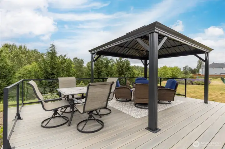 This composite deck with metal gazebo is a perfect space for entertaining or relaxing.