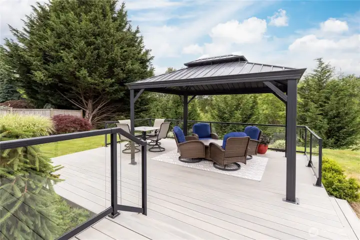 Enjoy an unobstructed, serene view of the backyard thanks to the stylish glass and metal railing.