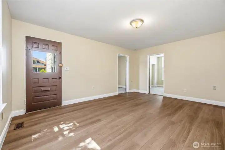 Another view of the main floor living room, showing the doorways on the right to two bedrooms. Another view of the main floor living room, showing the doorways on the right to two bedrooms.