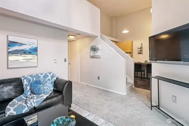 A soaring ceiling adds a feeling of spaciousness in this top-floor condo.