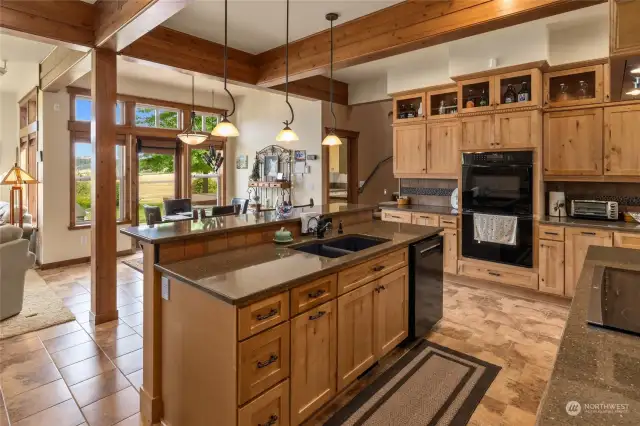 More of this custom kitchen. I love the exposed beams, boxed wood ceilings. They are a warm reminder this traditional home is in the mountains!