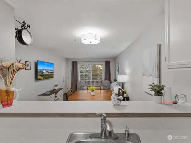 Never miss a moment - as this kitchen is  open to the dining and living rooms.