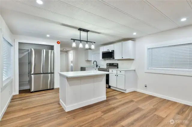 Kitchen Island with eating space adds to the kitchen counter space.