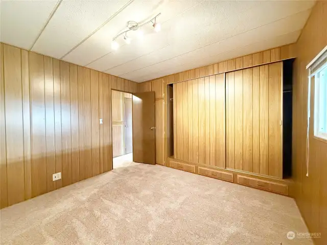 Bedroom #2 also features a large clothes closet with built-in drawers underneath, and another closet space behind the door.