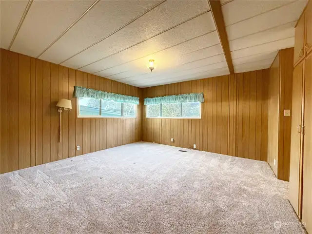 The Primary Bedroom has roughly 200 ft² of space for your bed and a sitting area--not to mention the extra storage space in the abundant cabinetry!