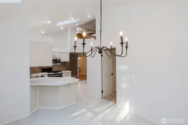 View from Breakfast nook into kitchen and door which leads to formal dining room