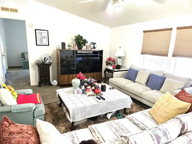 Living room leads to primary bedroom.