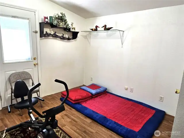 Third bedroom is being used as an exercise room.