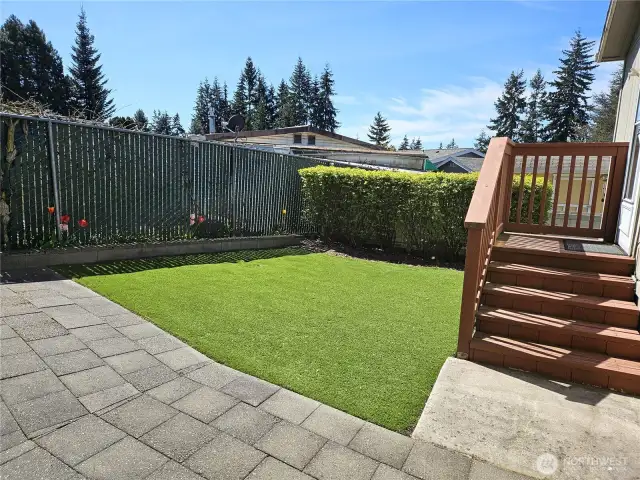 Enjoy outdoor living in the private fenced backyard with attractive, low-maintenance artifical grass.