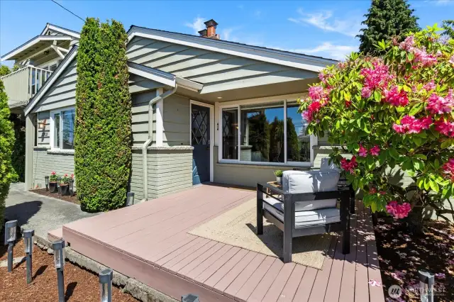 Private front deck with peek water and mountain views; adjust landscaping slightly to open up the views, if desired.