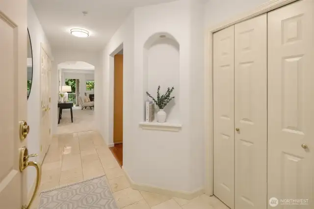 Foyer to unit with travertine