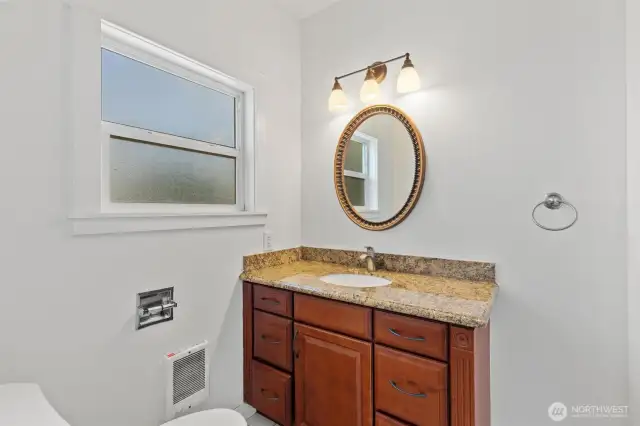 Nice full bath with tiled floors and tile surround in the tub/shower