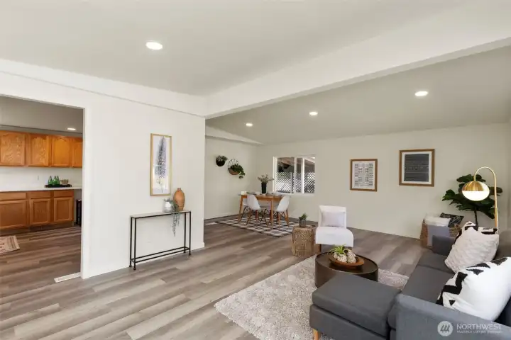 Living room open to kitchen and dining area