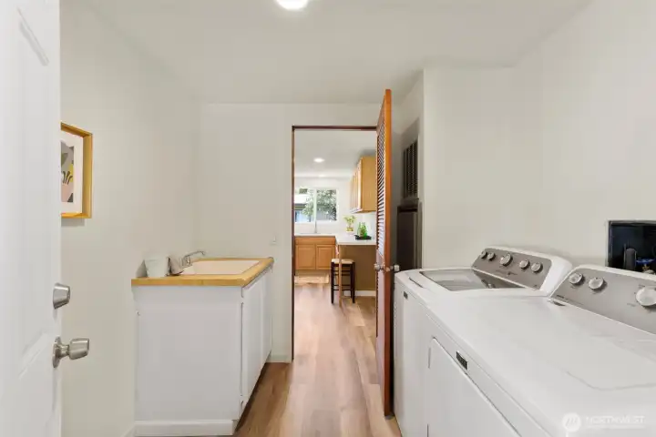 Laundry room and mud room with access out to the carport