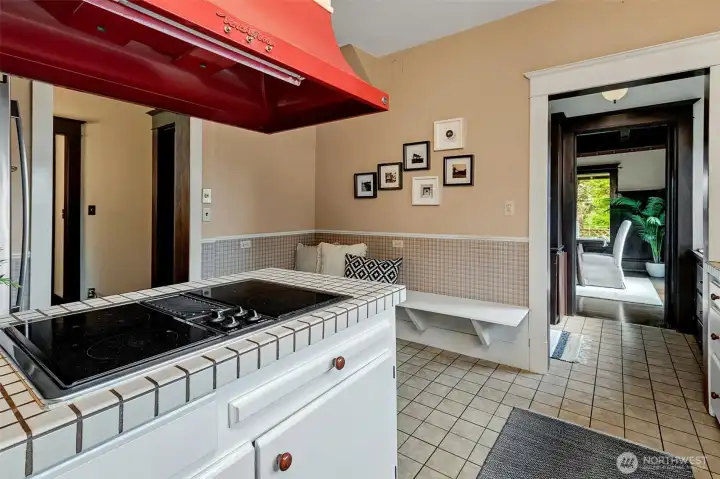 Cheerful kitchen with eating space for cozy mornings and casual dining. Butler's pantry between kitchen and dining room helps with meal and beverage prep for special occasions.